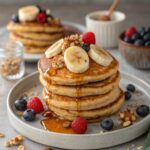 A perfect stack of fluffy banana protein pancakes, ready to eat.